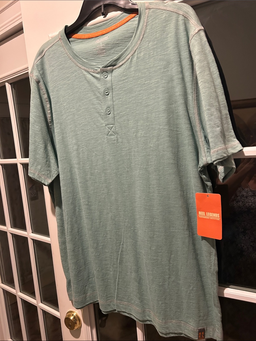 Reel Legends Men’s Light Sage Henley Short Sleeve Tee with Orange Tag